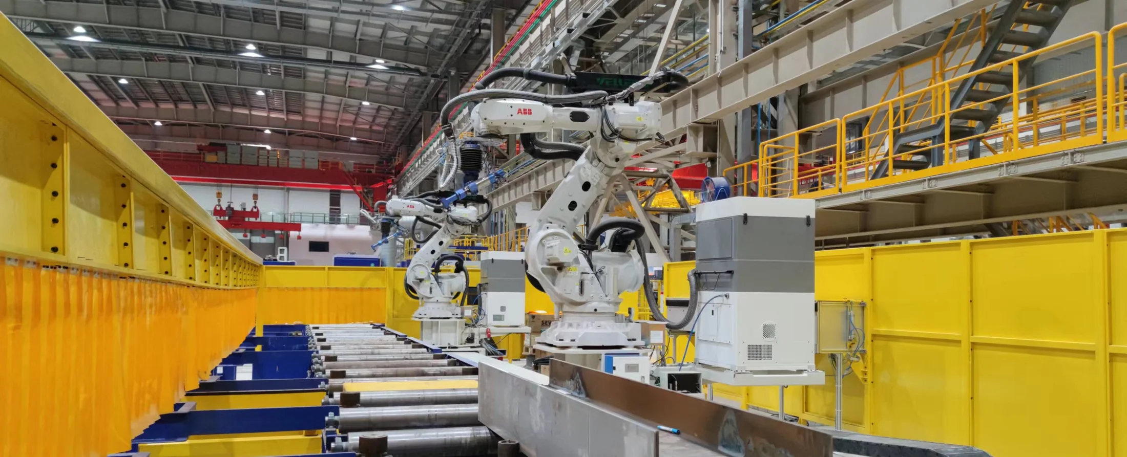 Robotic welding production line with rail-guided robots